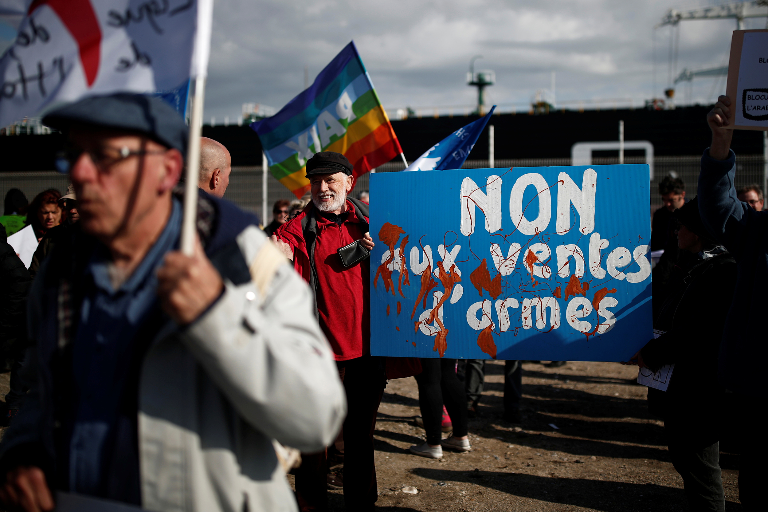 People attend a demonstration to protest against the loading of weapons aboard the Bahri-Yanbu, a cargo ship operating for Saudi Arabia's defence and interior ministries, in Le Havre, France, May 9, 2019. The banner reads: "No to arms sales".